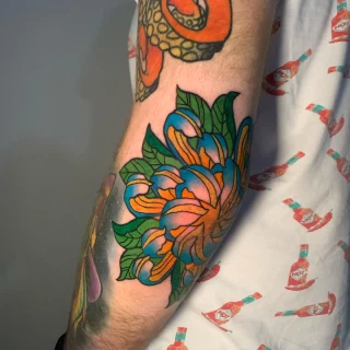 Flower on elbow - OldSchool Tattoo - Black Hat Tattoo Dublin - The Black Hat Tattoo