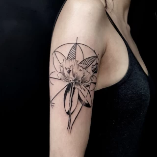 Flower tattoo on upper arm -  - Blackwork Darkwork - Black Hat Tattoo Dublin - The Black Hat Tattoo