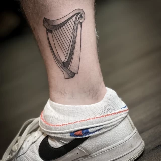 Celtic Harp on ankle - Irish & Celtic Tattoo - Black Hat Tattoo Dublin - The Black Hat Tattoo