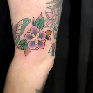 Flower on leg - OldSchool Tattoo - Black Hat Tattoo Dublin - The Black Hat Tattoo