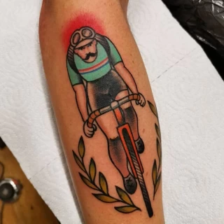 Man on bicycle - OldSchool Tattoo - Black Hat Tattoo Dublin - The Black Hat Tattoo