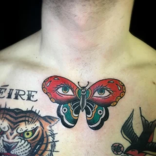 Butterfly on chest - OldSchool Tattoo - Black Hat Tattoo Dublin - The Black Hat Tattoo